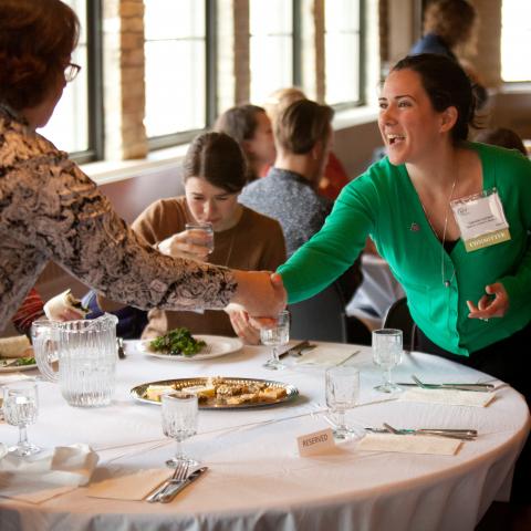 Members greeting each other at luncheon