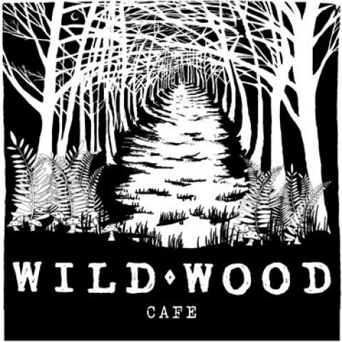 Black and white image of a wooded area. WILDWOOD Cafe is printed at the bottom of the image.